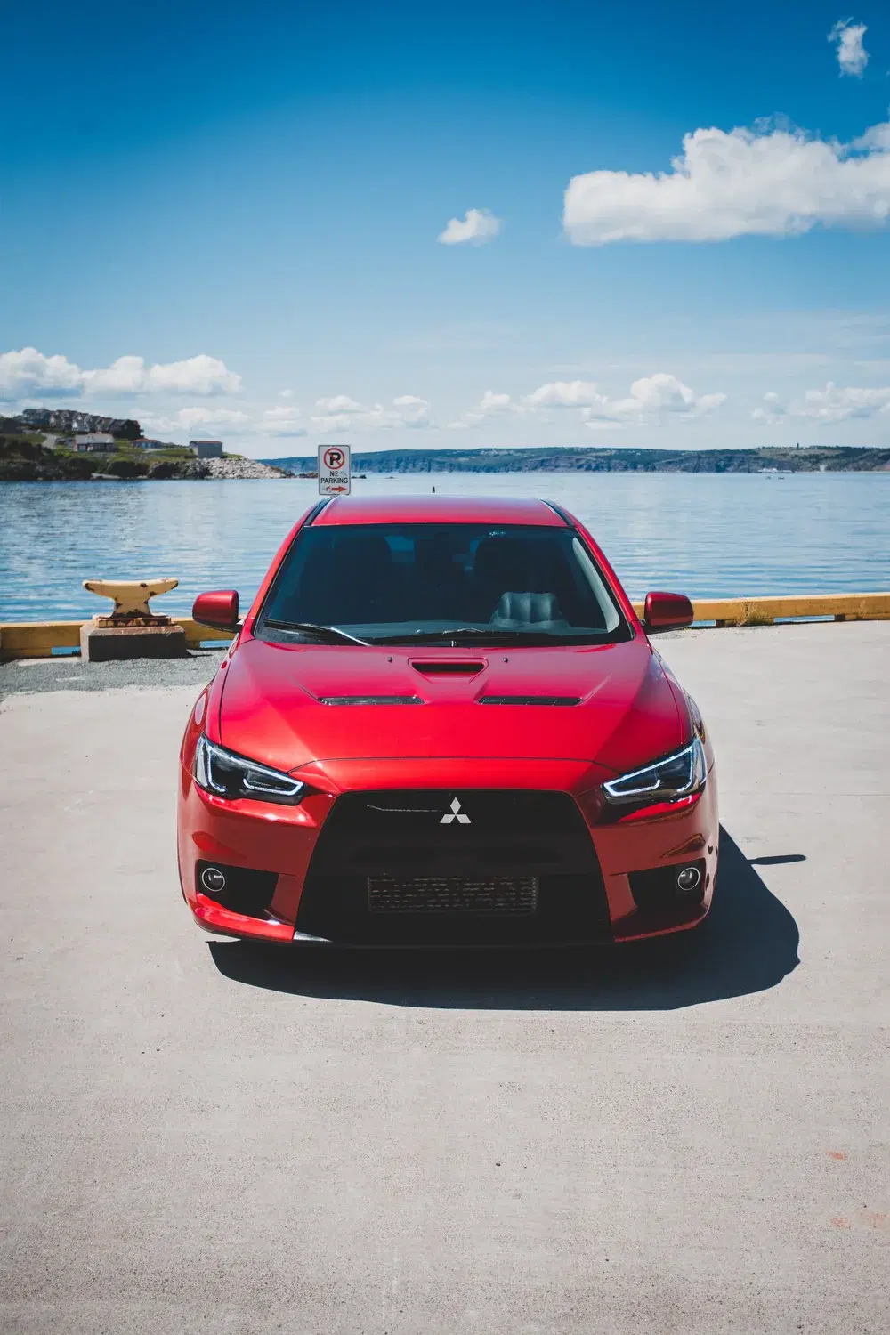 Black Mitsubishi Eclipse Cross SUV at a three-quarter front angle on a solid black background
